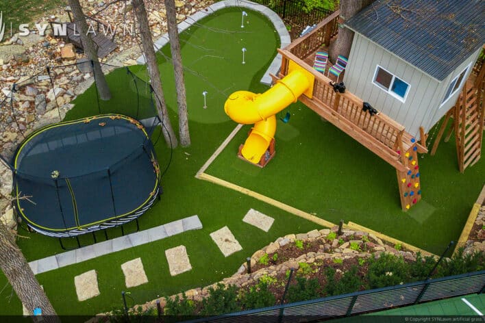 image of SYNLawn Green Bay WI residential backyard treehouse trampoline